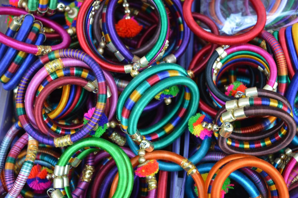 Colorful Rajasthani bangles on display in Jaipur market showcases traditional Indian craftsmanship.